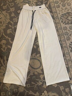 ALO Yoga Wide Leg Drawstring Pants in White with Black Drawstring